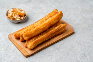 Youtiao or Yu Char Kway is a long golden-brown deep-fried strip of wheat flour dough of Chinese origin
