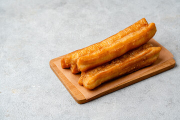 Youtiao or Yu Char Kway is a long golden-brown deep-fried strip of wheat flour dough of Chinese origin