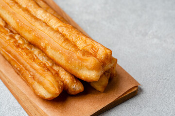 Youtiao or Yu Char Kway is a long golden-brown deep-fried strip of wheat flour dough of Chinese origin