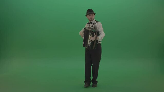 Man in black hat play music with Accordion in full size isolated on green screen