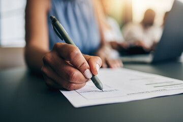 Closeup, hand and a person with a document for accounting, finance paperwork or business. Desk,...