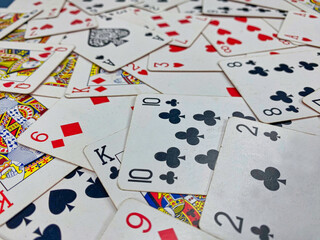 Playing cards spread out on a table