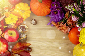 Autumn background, vegetables, fruits and leaves on wooden boards with copy space. Harvested autumn...