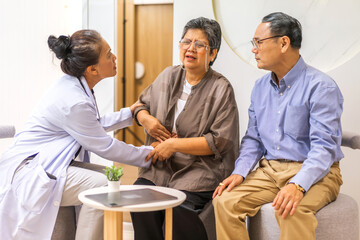 Fototapeta premium Woman doctor with stethoscope help support discussing and consulting care talk to sick senior asian woman patient in hospital,caregiver,elderly,recovery,illness insurance.healthcare and medicine