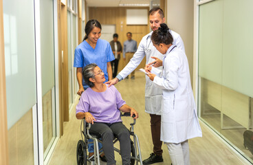 Obraz premium Man doctor with stethoscope service help support discussing and consulting care talk to sick senior asian woman patient in hospital,caregiver,elderly,recovery,illness insurance.healthcare and medicine