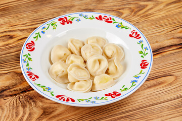 dumpling with meat on wooden background