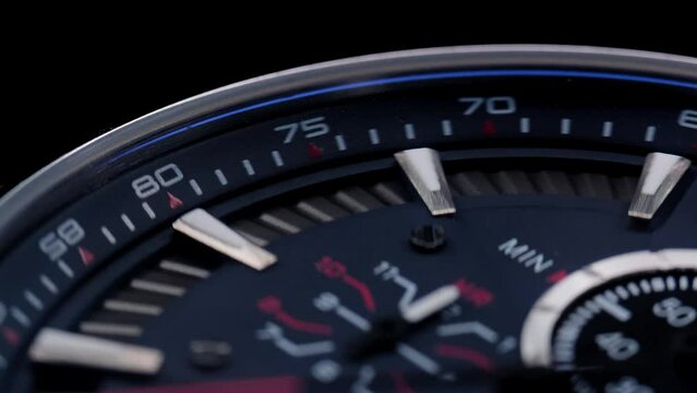 Close Up Of Stylish Luxury Man Wrist Watch With Moving Hand And Multiple Dials. Men's chronograph watch in metal with sapphire crystal. closeup view of rotating watch, running second arrow. blue dial