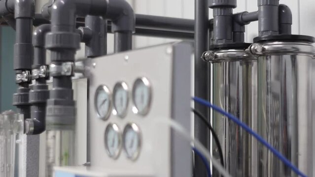 The process of reverse osmosis. System filters water, compressors, pressure indicators, tubes and other parts of facility