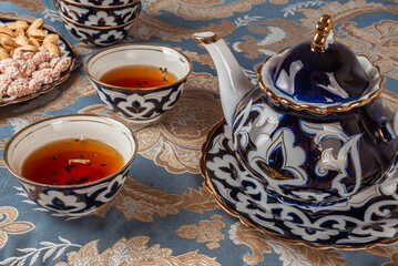 traditional uzbek tea with nuts - obrazy, fototapety, plakaty