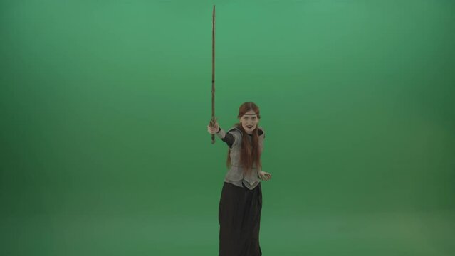 Girl shouts her foes on an offensive raising a sword up on a green background
