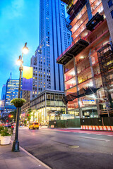 Obraz premium Fifth Avenue or 5th Avenue New York with cars, people and its various buildings. 2023.