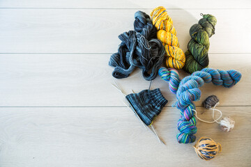 Colored threads, knitting needles and other items for hand knitting