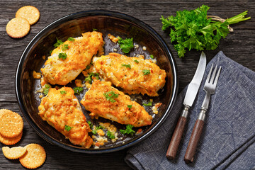 baked chicken breasts under cracker cheese crust