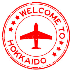 Grunge red welcome to hokkaido with airplane icon round rubber seal stamp on white background - obrazy, fototapety, plakaty
