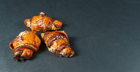 Croissant chocolate close up on black background