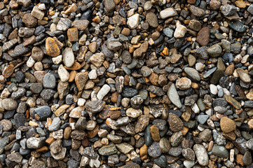 Small Stones Pebbles Gravel texture background. Full Frame.