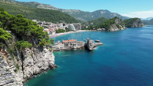 Petrovac na Moru Aerial View. Beaches and coastline of the Adriatic Sea at summer time. Natural landscapes of Montenegro. Balkans. Europe.	