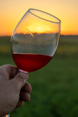 Wine in a glass at sunset