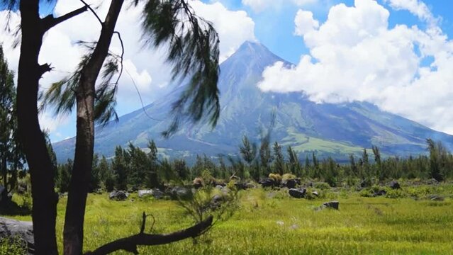White ash clouds emit from Mayon volcano crater on a clear day. selective focus