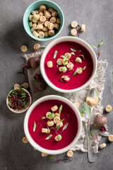 Tasty borsch soup with cream and croutons.