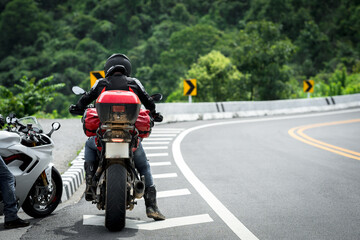 motorcycle on the road rides away. Travel on vacation, enjoy the nature trail. motorcycle in a...