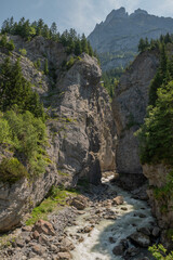 River among canyon rocks Switzerland Alps