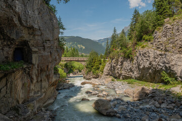 River among canyon rocks Switzerland Alps