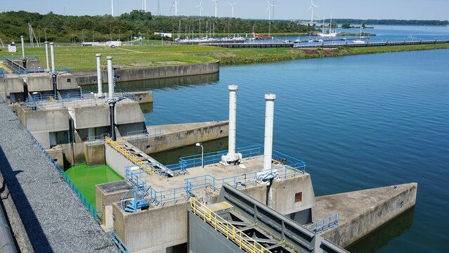 Waterworks at Haringvliet lock in the Netherlands. Delta works that separate water from salt to fresh and influence the tides of high and low water. Concrete construction.
