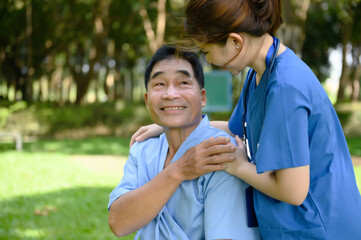 Asian Female Doctor Touching Hand of the Senior Patient to Give Encouragement while Maintaining Physical Health Rehabilitation..