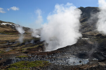 Fototapeta na wymiar Piping Hot Landscape with Steam Rising from Geothermal Activity