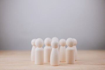 Wooden dolls on a white background. social coexistence and Team decision or working together concept.