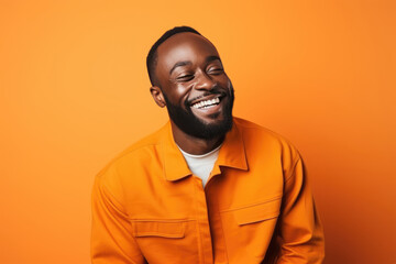 Obraz premium Happy Nigerian Man On Orange Background