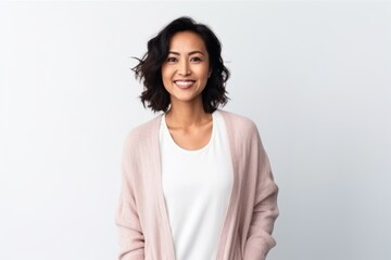 Obraz premium Medium shot portrait of a Indonesian woman in her 30s in a white background wearing a chic cardigan