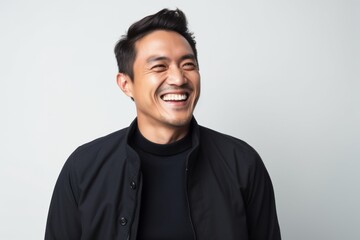 Obraz premium Portrait of a happy asian man isolated on a white background