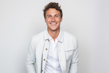 Portrait of handsome man smiling at camera over white background. Man looking at camera