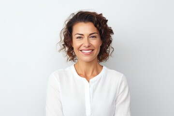 Medium shot portrait of a Russian woman in her 30s in a white background wearing a chic cardigan
