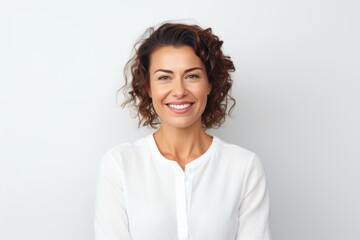 Fototapeta premium Medium shot portrait of a Russian woman in her 30s in a white background wearing a chic cardigan