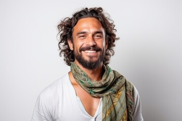 Fototapeta premium Medium shot portrait of a Brazilian man in his 30s in a white background wearing a foulard