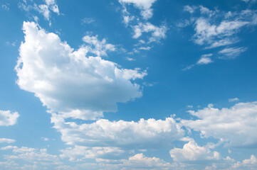 Blue sky filled with white clouds above lake Uvildy in summer, South Urals, Russian Federation