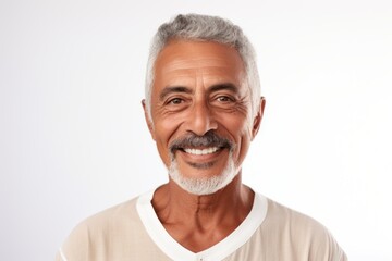 Obraz premium Portrait of smiling senior man looking at camera isolated over white background