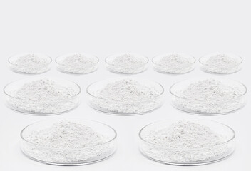 petri dishes with various chemicals, phosphate, zinc, polycyanate, resveratrol, cellulose, betulin and other pharmaceuticals, on isolated white background