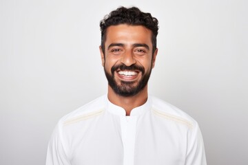 Obraz premium Portrait of handsome young man with beard smiling and looking at camera
