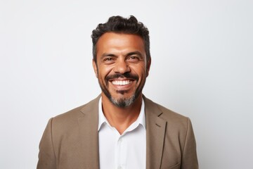 Portrait of a handsome man smiling at the camera over white background