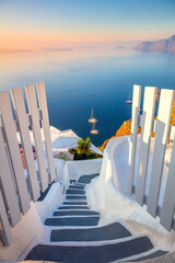 Gateway to rest. Santorini, Greece. Dawn of the sun, open doors and steps to the blue sea of Santorini island, Oia. - 636709555