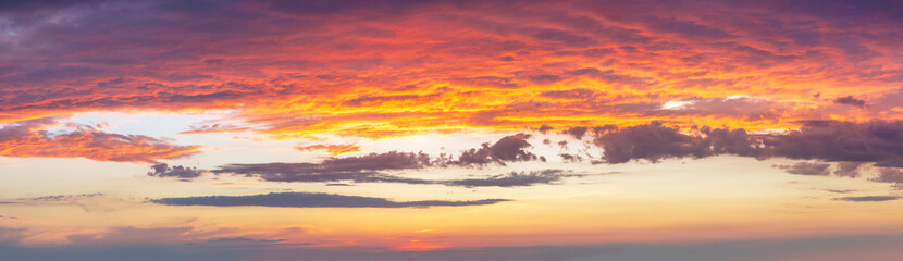 Fototapeta premium Кeal dramatic sunrise against a sky with colorful clouds. Amazing Sunset. Sundown. Without any birds. Large panoramic