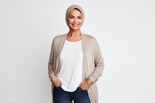 Portrait Of A Smiling Muslim Woman In Hijab Standing Over White Background