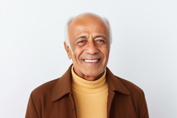 Portrait of a smiling senior asian man looking at camera against white background