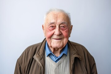 Portrait of an old man with wrinkles on his face, grey background