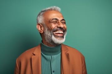 Fototapeta premium happy african american senior man with closed eyes on green background