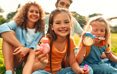 Happy family relaxing in the park